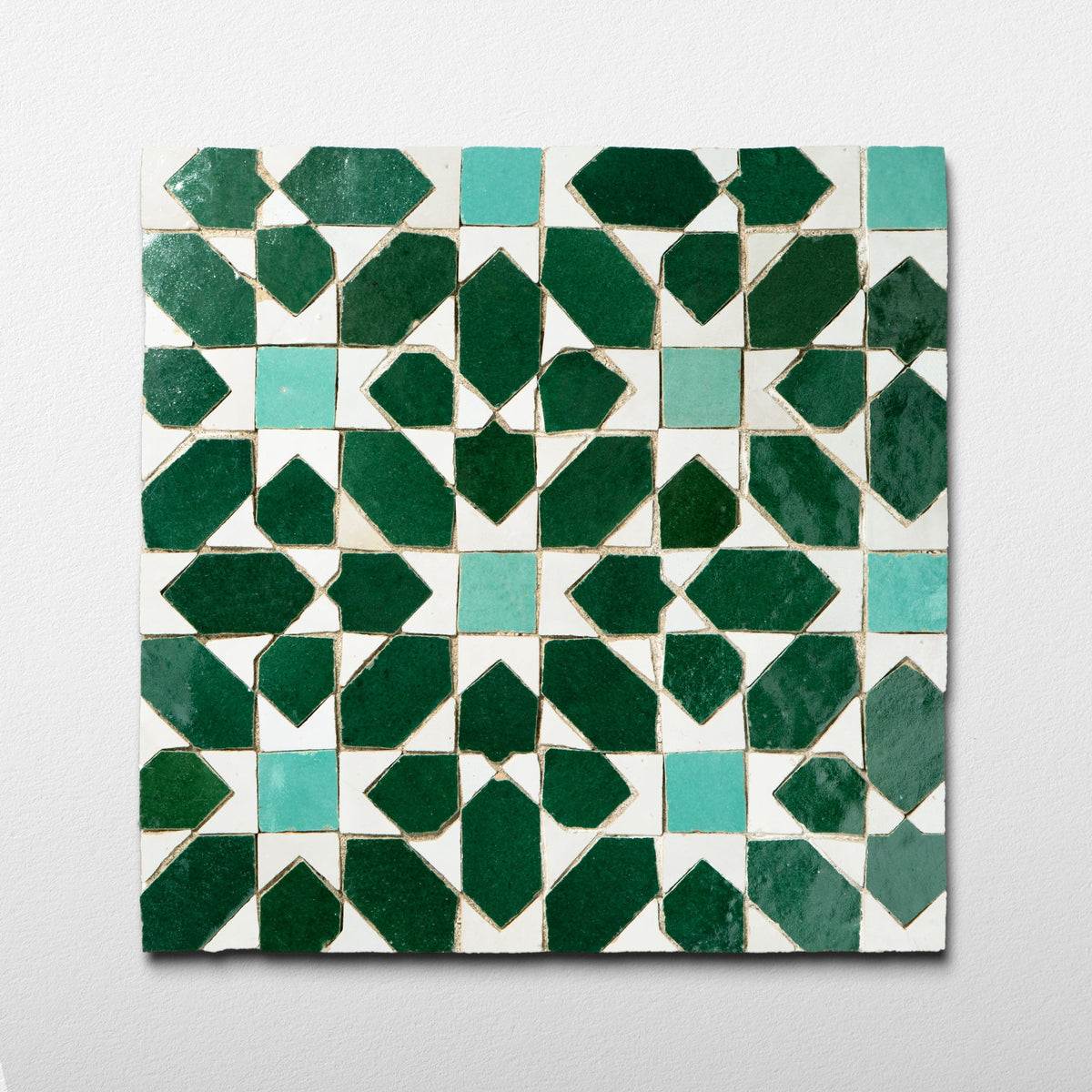 Garden Green zellige mosaic with deep green and aqua shapes on white handmade Moroccan terracotta