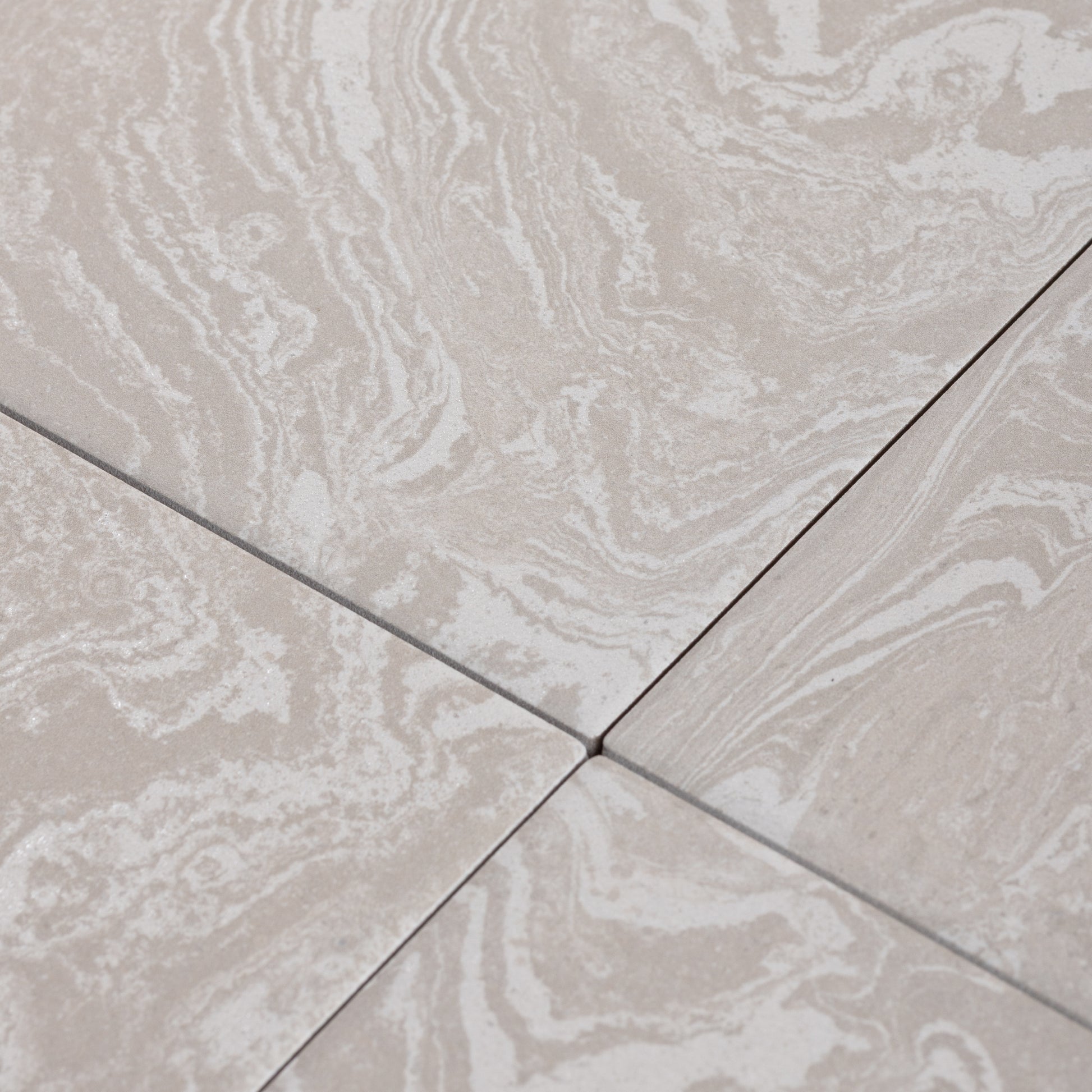 Close-up of beige tiles with marble-like pattern porcelain tile