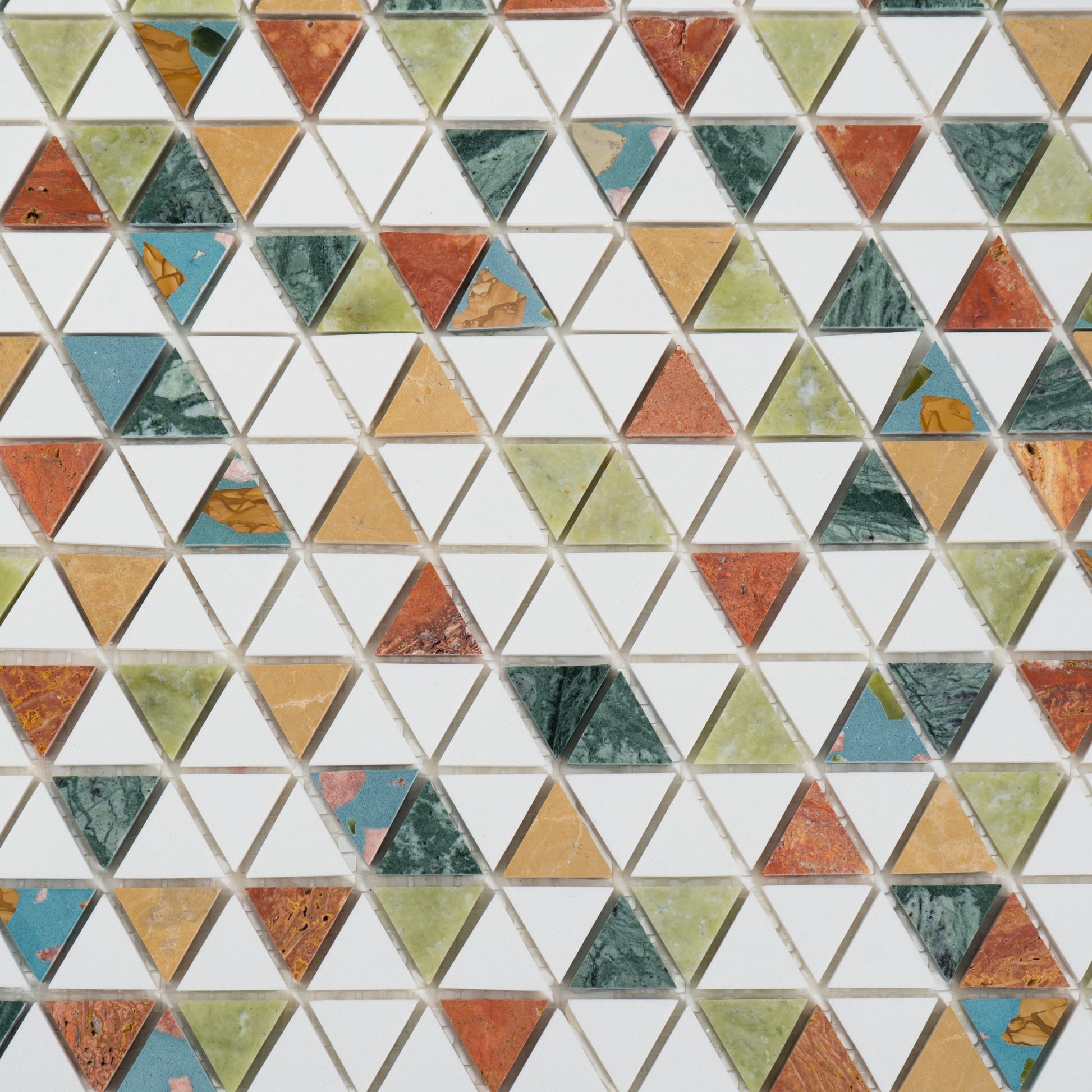Pattern of multicolored triangular tiles arranged in a geometric design.