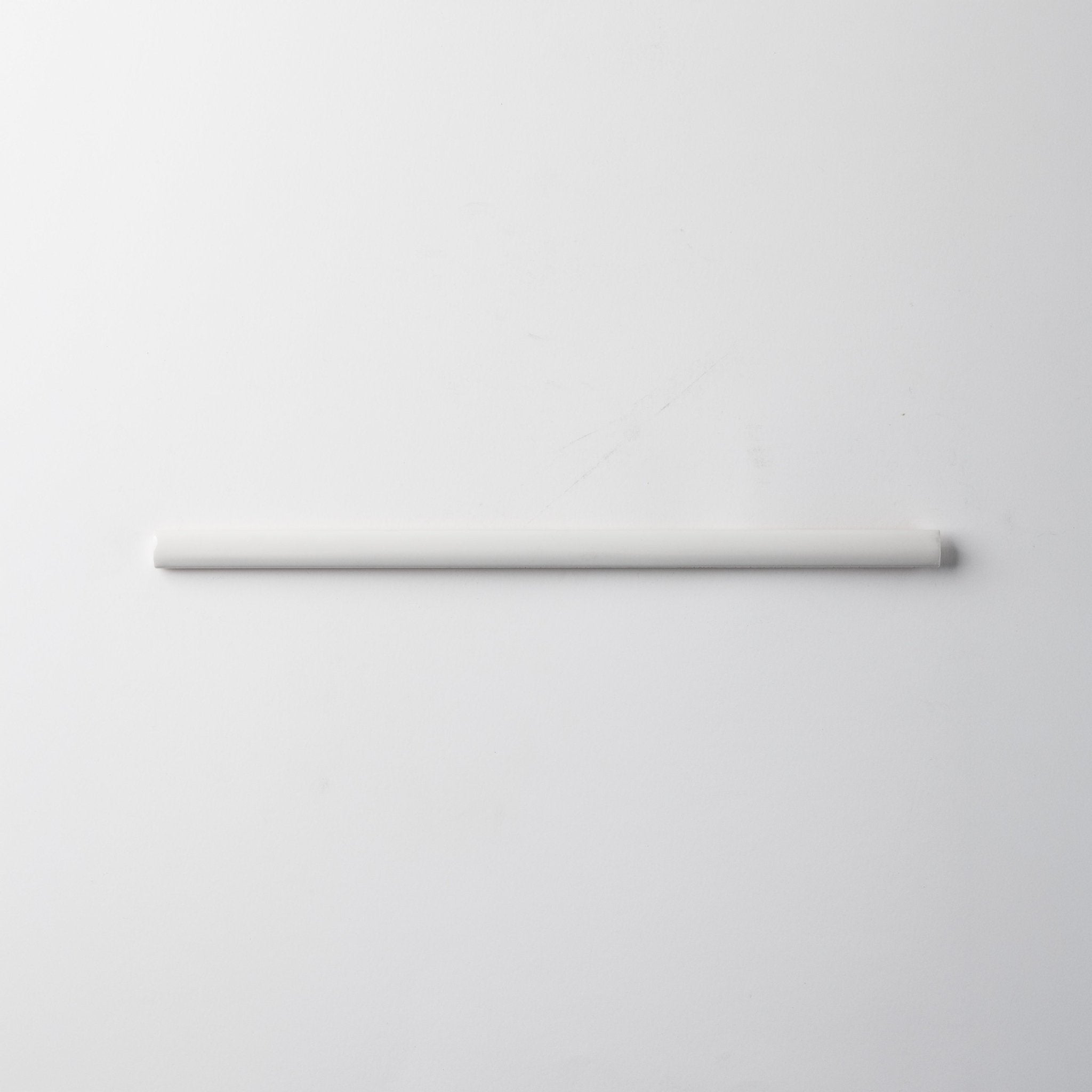 Extruded Off White Glossy Pencil - 1⁄2X12 - Cemento Collection
