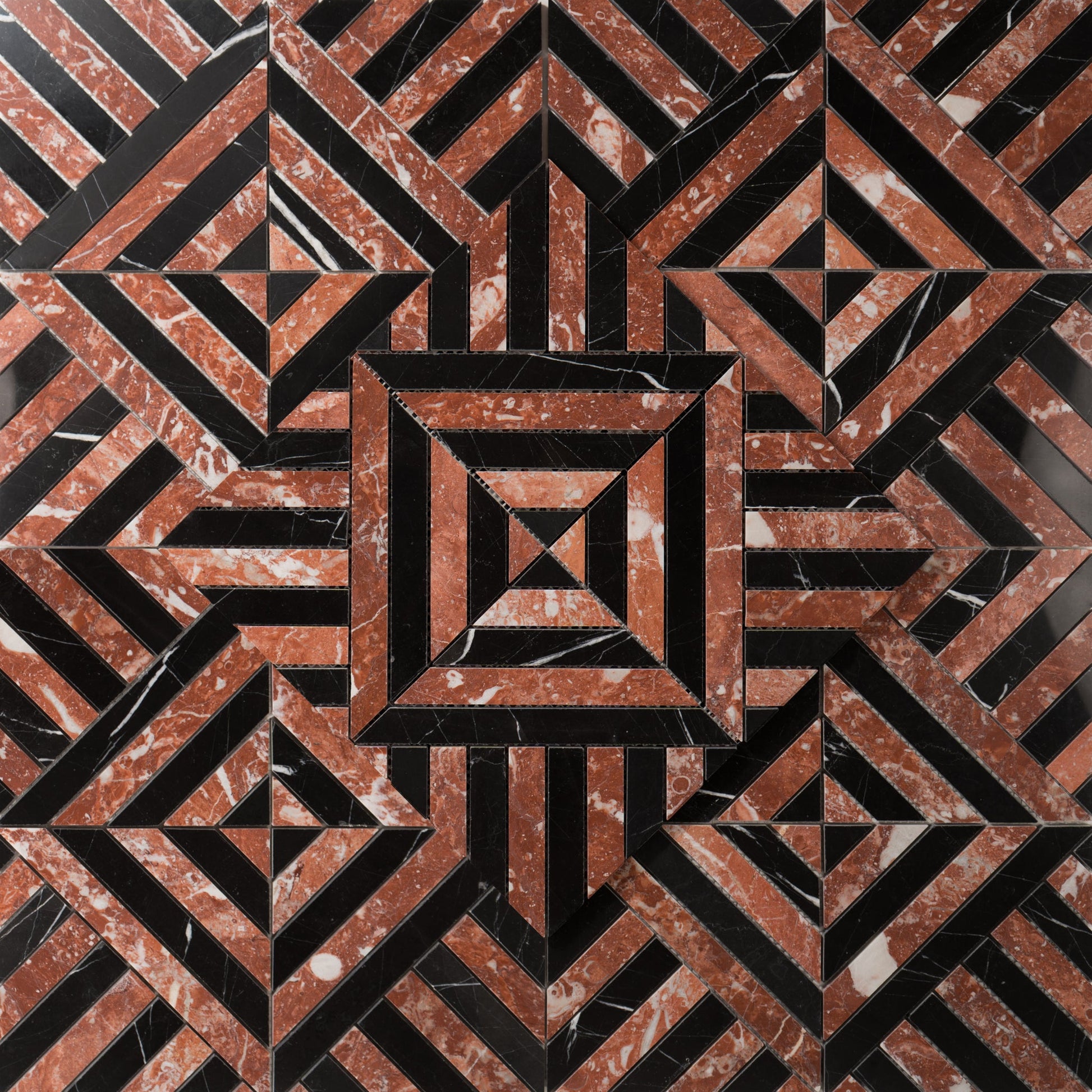 Geometric pattern of interlocking triangles in red and black