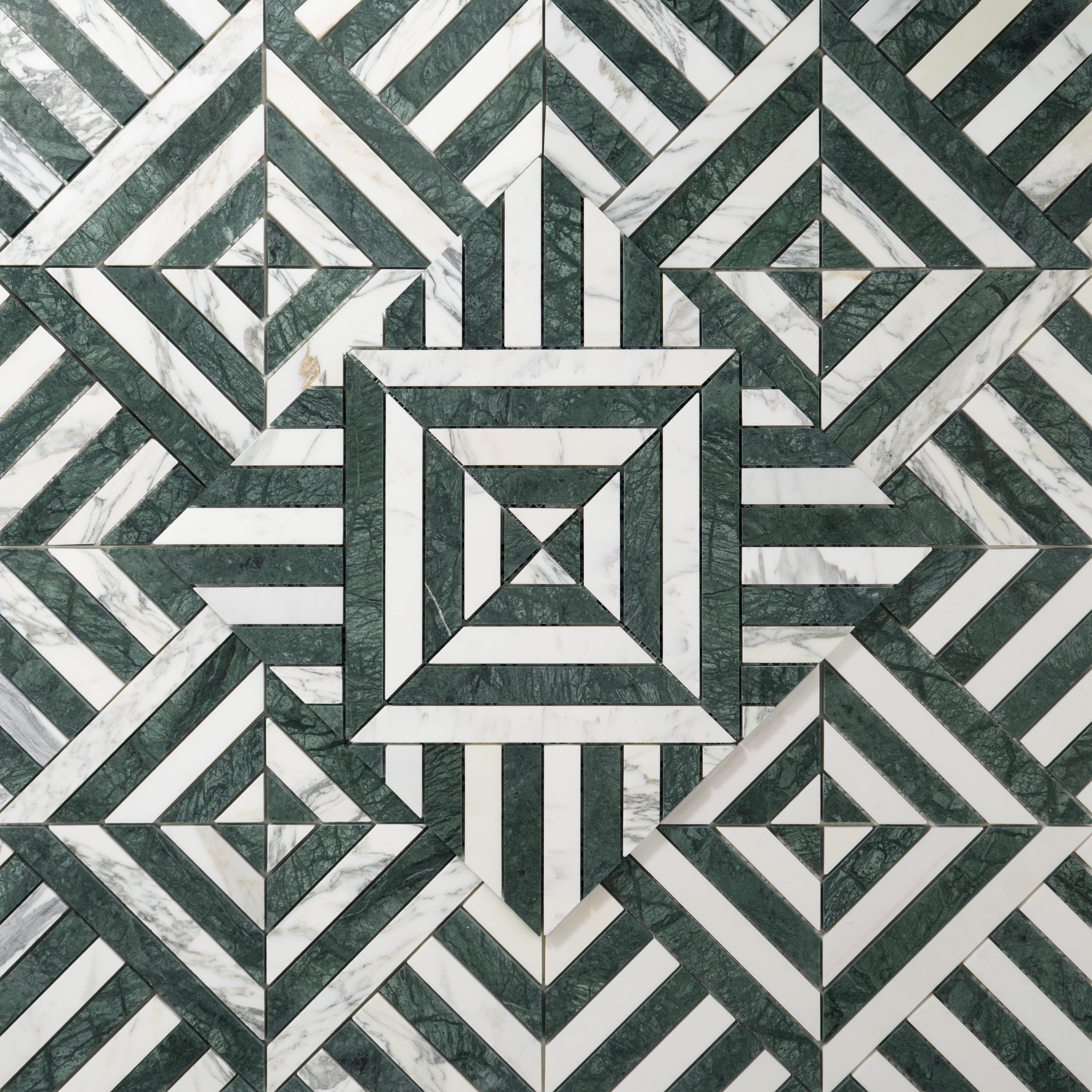 Geometric pattern of green and white tiles