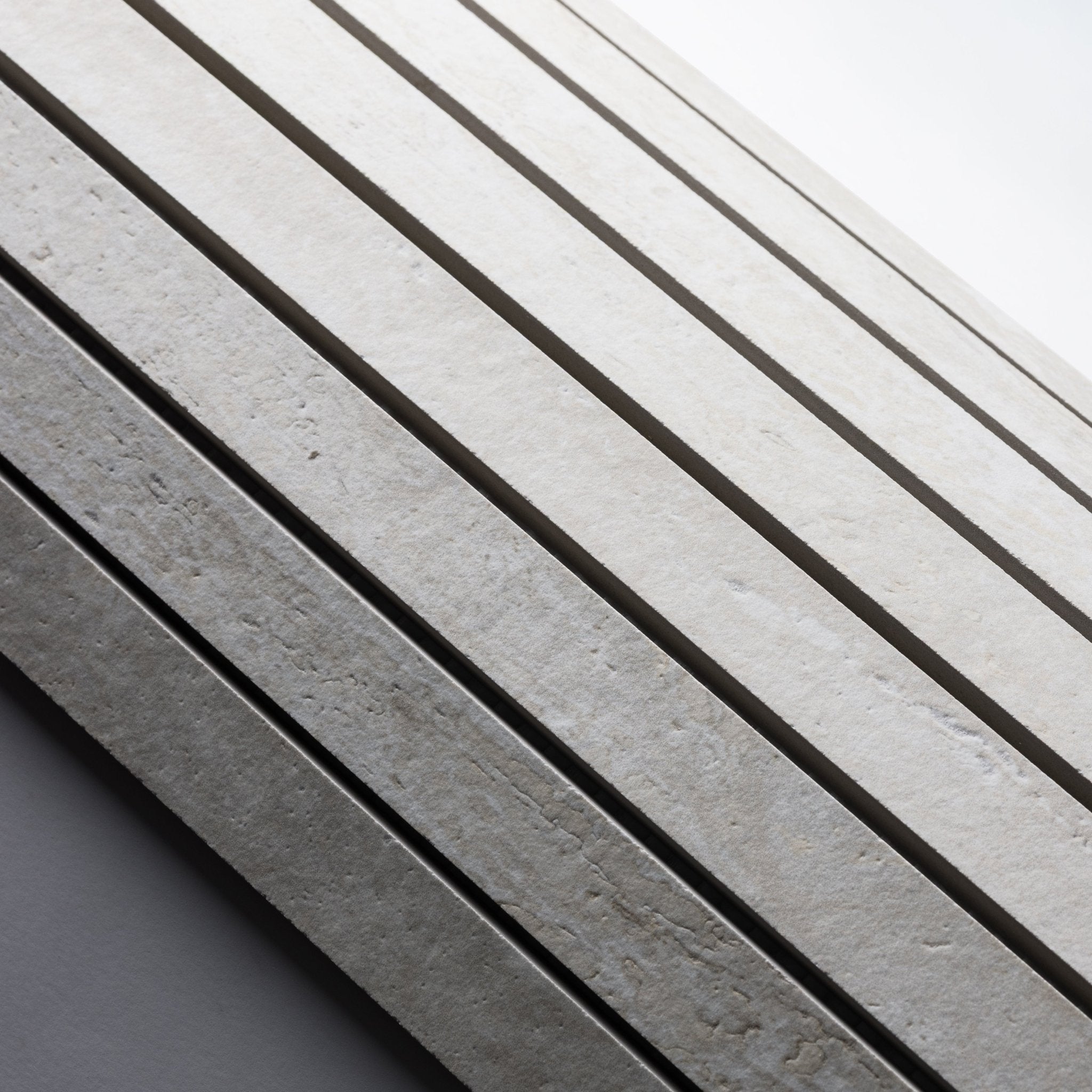 White Travertine 1x48 Strip Porcelain Tile - Cemento Collection